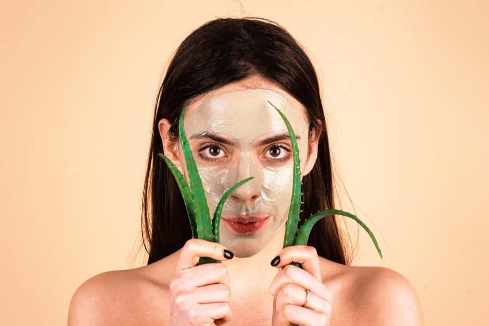 applying vitamin E capsule oil on face at night