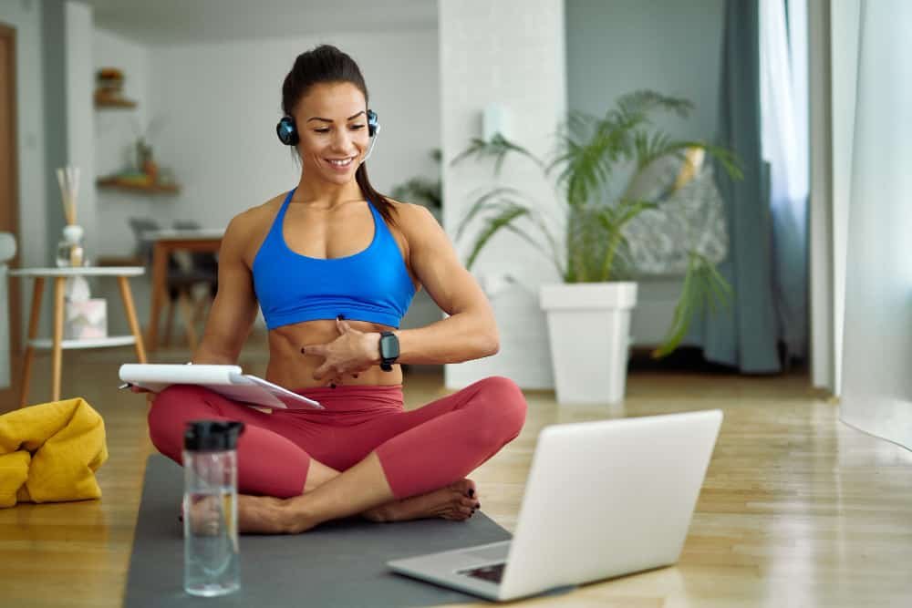working woman doing daily morning yoga at home