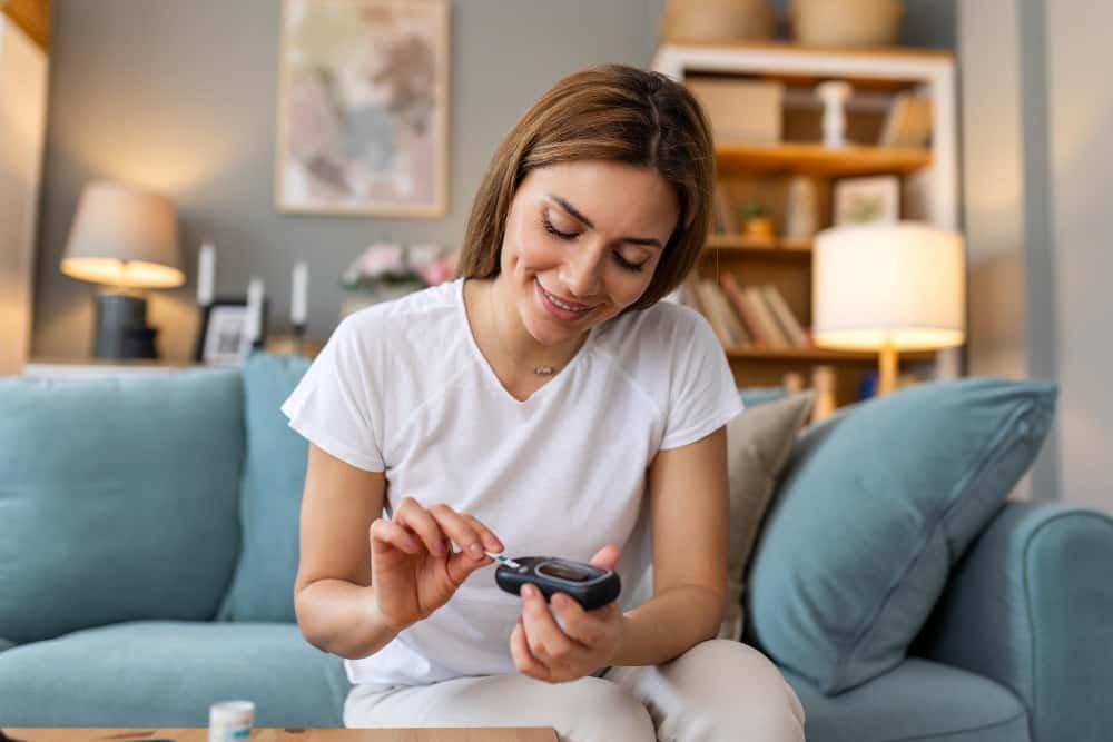 person checking blood sugar at home