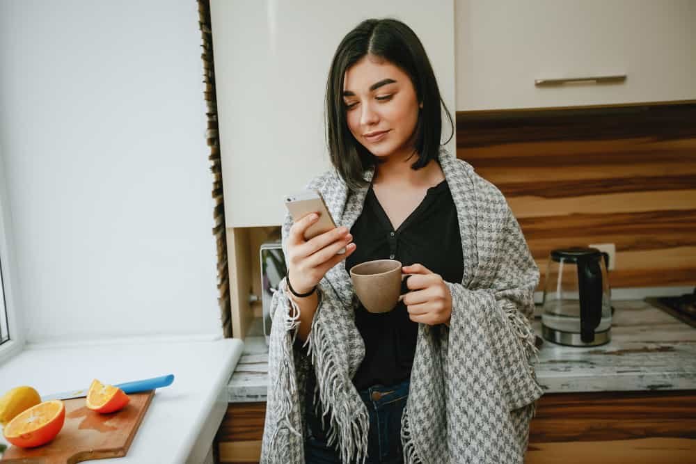 woman avoiding mobile phone during morning routine