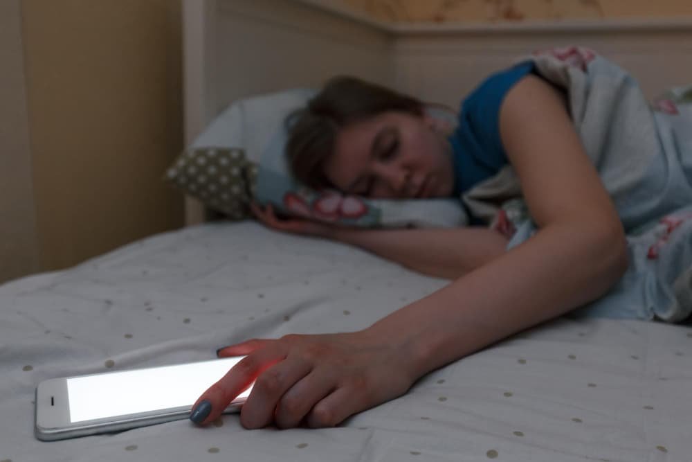 woman avoiding mobile phone during morning routine