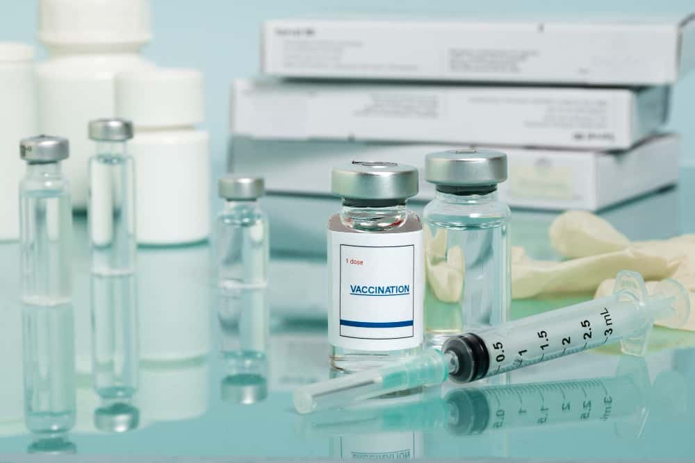 Doctor discussing measles vaccine with parents