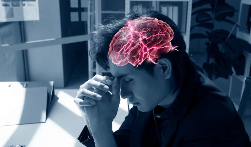 Woman experiencing brain fog and mental fatigue at work
