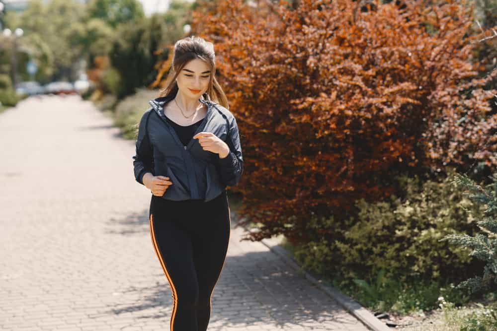 Person walking on a trail to improve energy levels